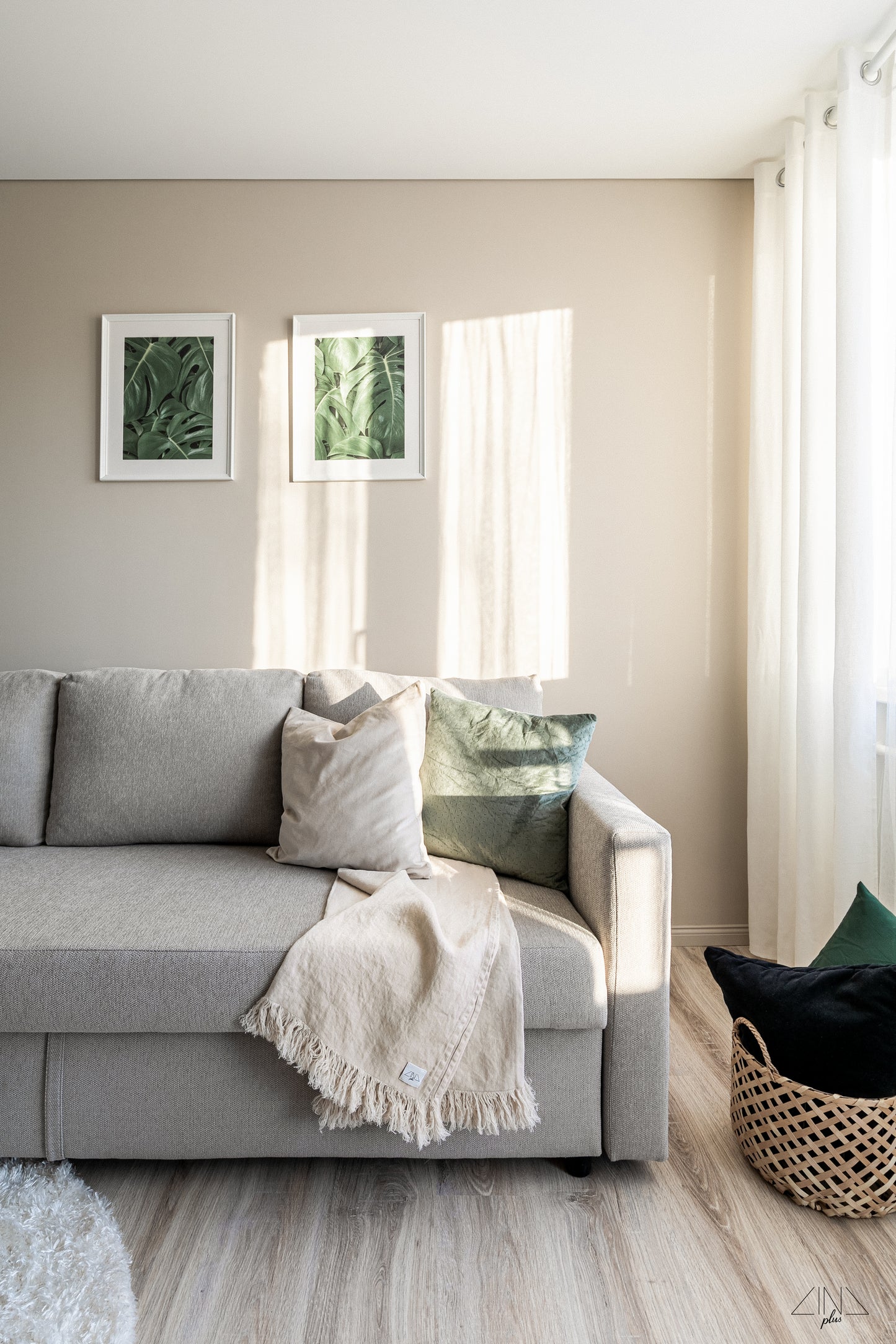 Heavy Weight Linen Throw with fringes in color Cream draped on a sofa.
