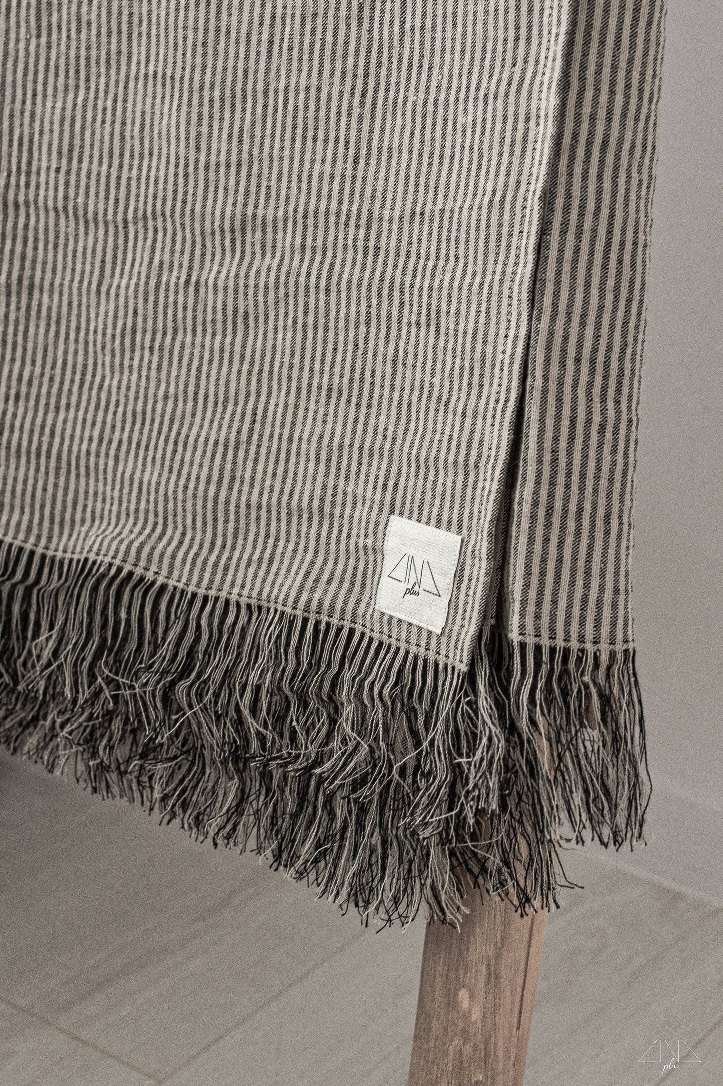 Striped Medium Weight Linen Throw with fringes in Black and Natural ticking stripes.