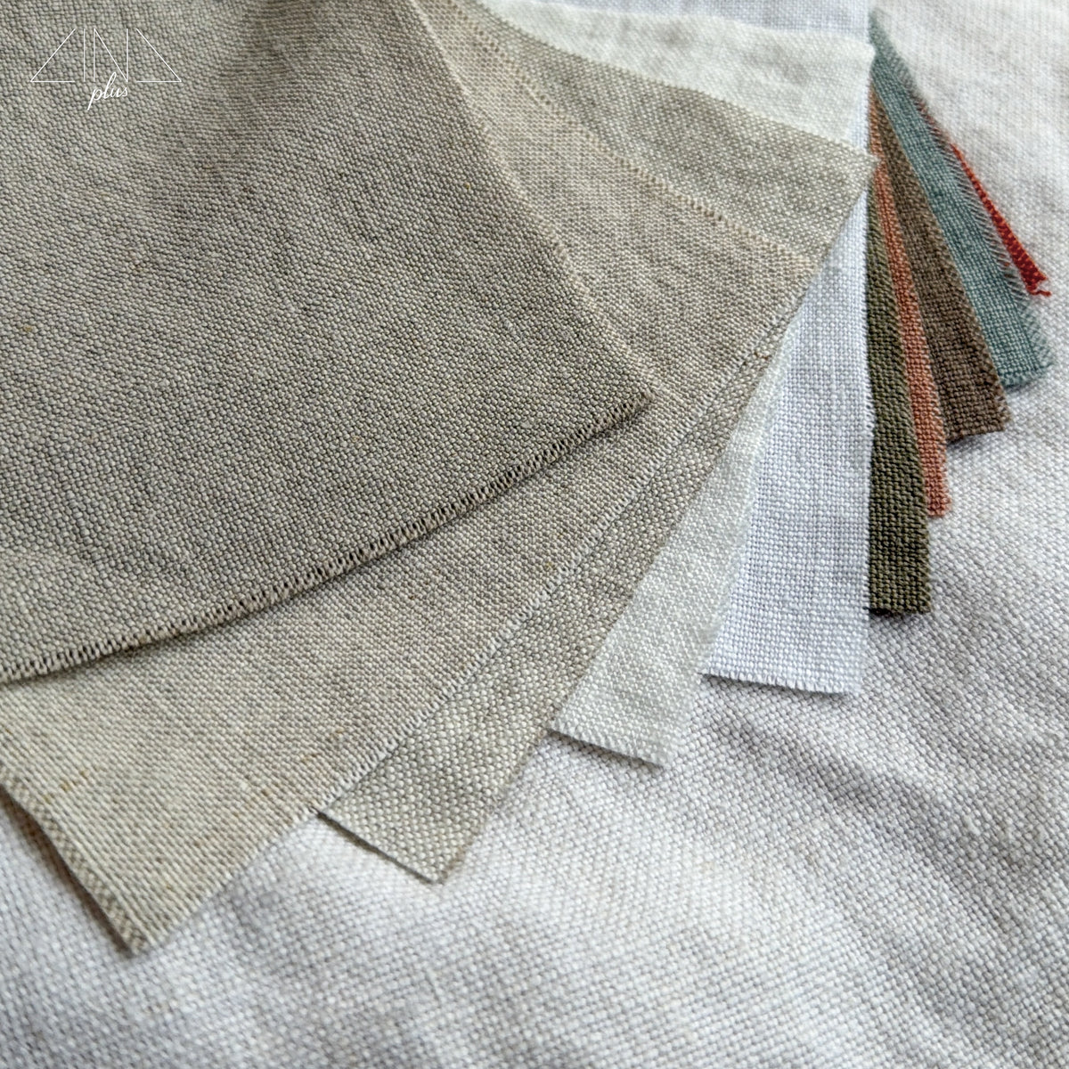 Linen fabric samples in various colors arranged in a fan display