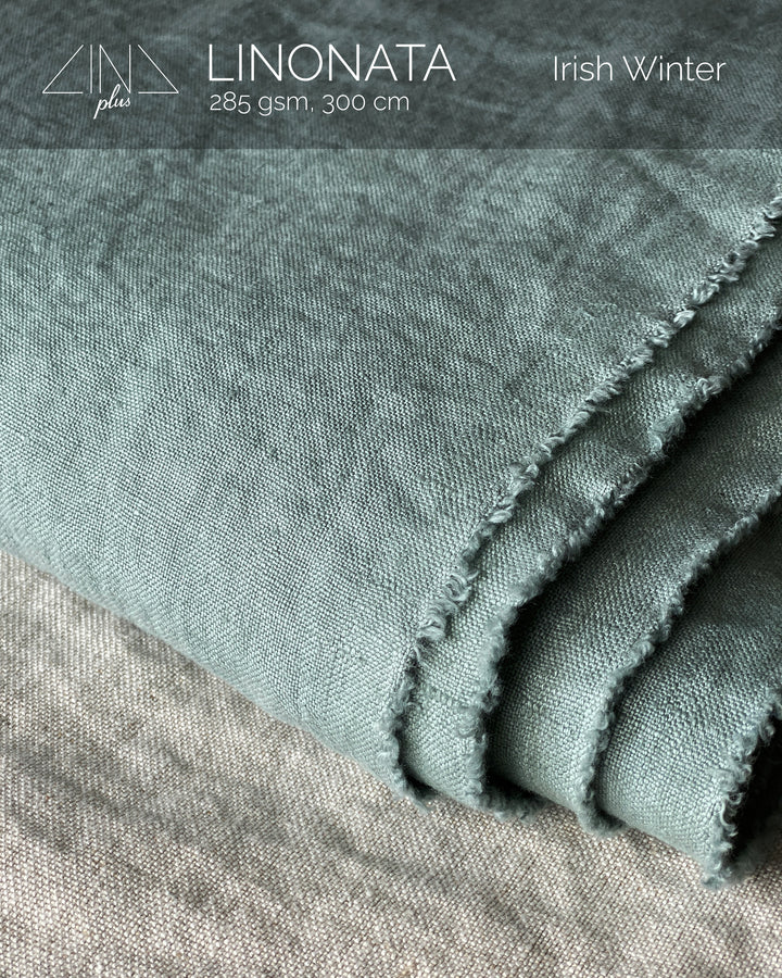 LINONATA Irish Winter linen tablecloth fabric swatch showing folded textile in sage and neutral tones