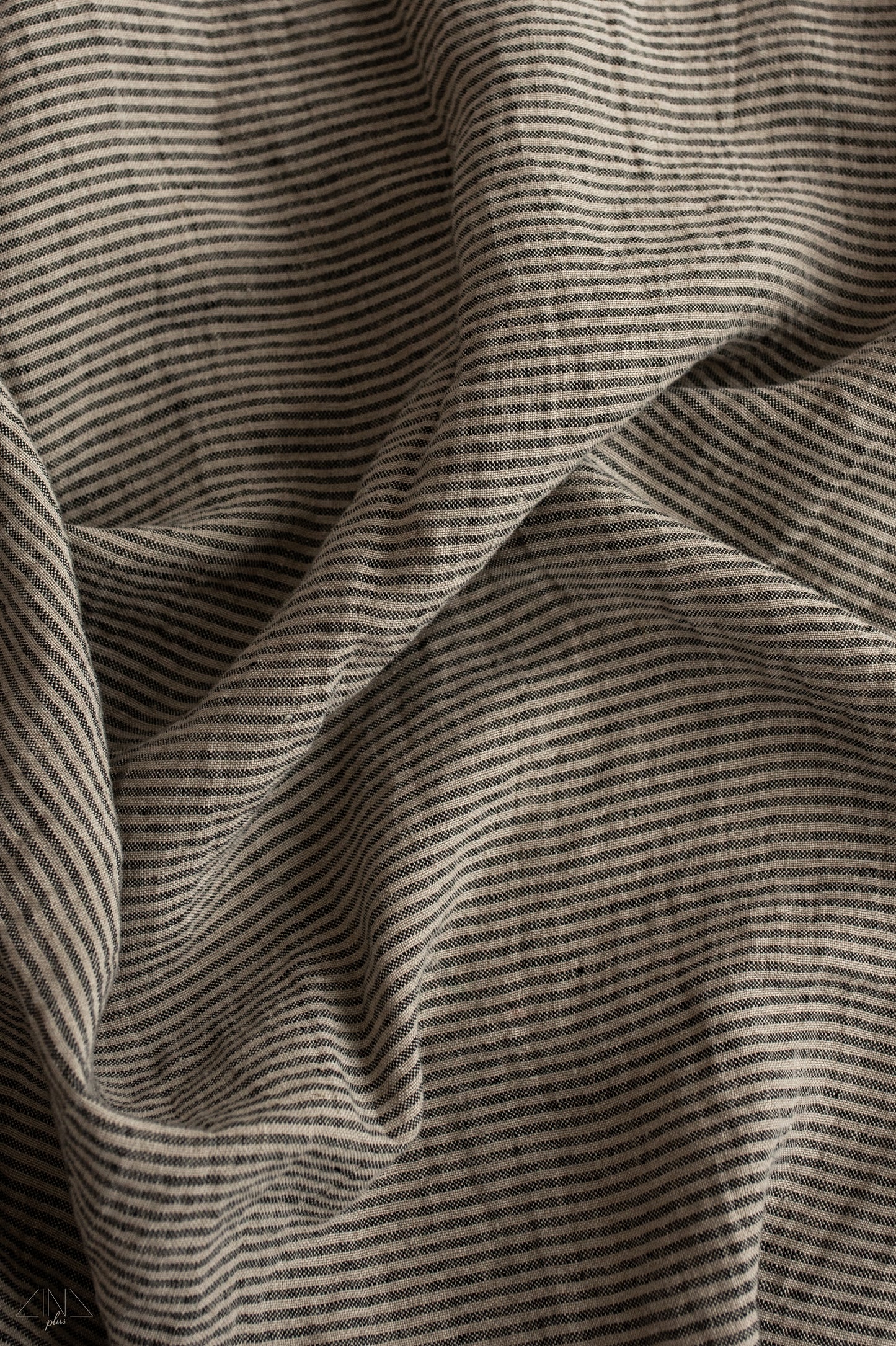 Striped Medium Weight Linen fabric in Black and Natural ticking stripes.